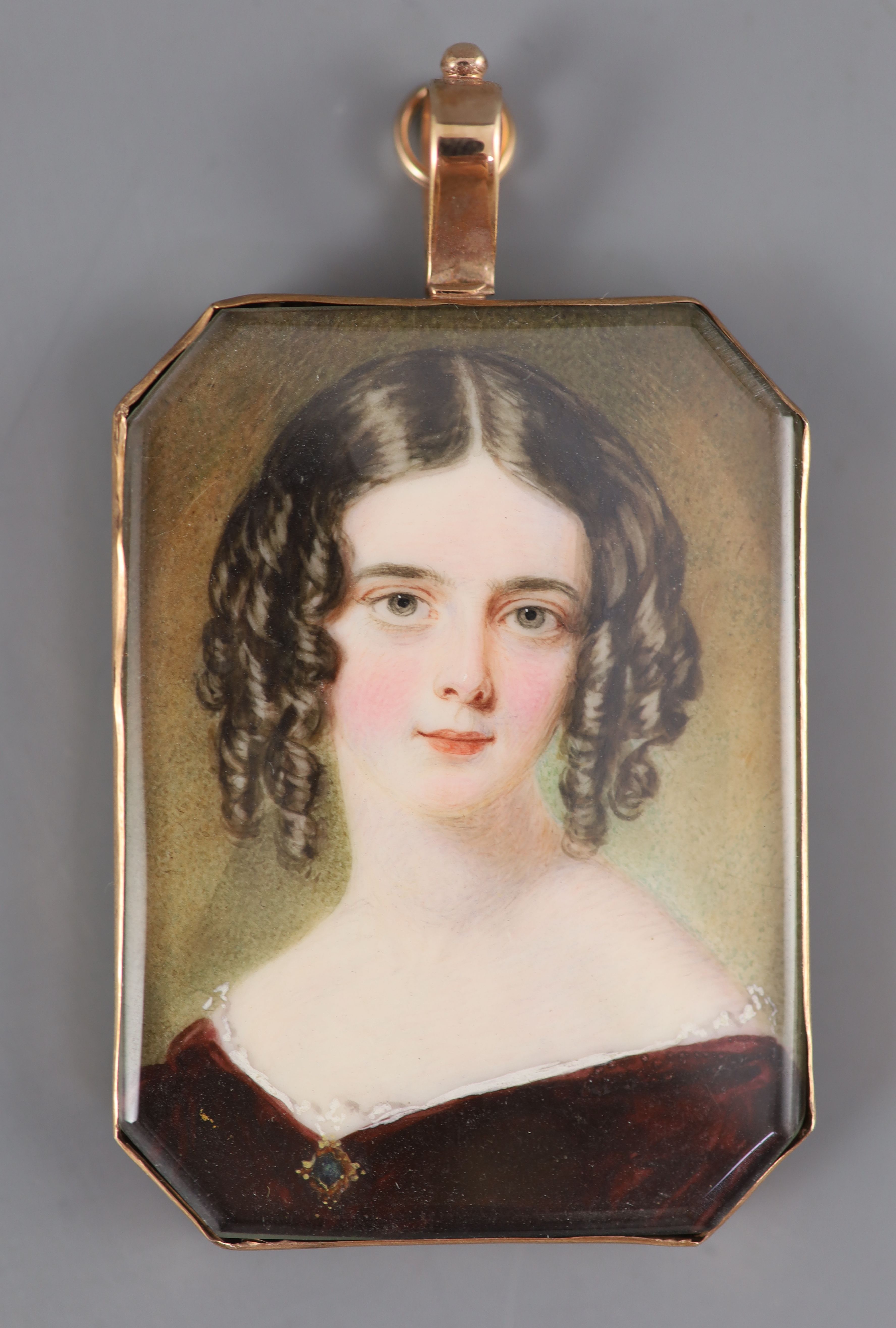 William Egley (1798-1870) Portrait miniature of a young lady wearing a purple dress and sapphire set jewel 2 x 1.5in, gold framed